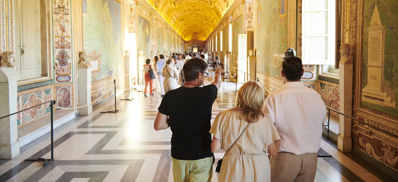 A private guide explains the Gallery of Maps inside the Vatican Museums A private guide explains the Gallery of Maps inside the Vatican Museums