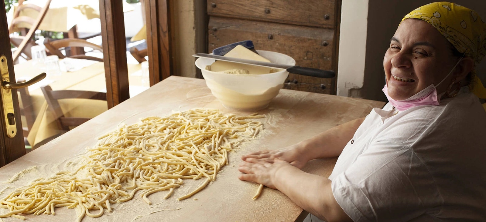 World famous Nonna from Osteria da Fortunata, making pasta on window on the streets in Rome World famous Nonna from Osteria da Fortunata, making pasta on window on the streets in Rome